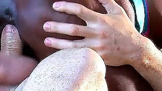 Ebony MILF Naomi fucks young vacation flirt on the beach