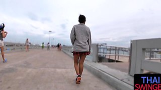 Thai babe in a miniskirt gives raw POV BJ outdoors