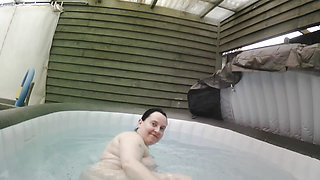 Brunette Wife with big breasts Naked in the Hot Tub