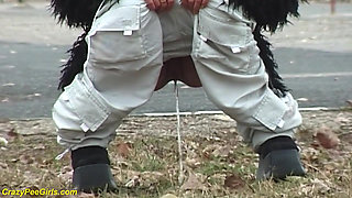 Young girl pissing on street