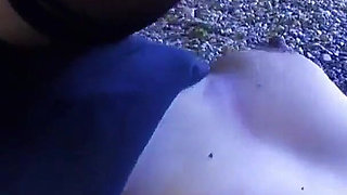 The MILF is a slut with huge breasts and a shaved vagina enjoying a cock inside her pussy on the beach