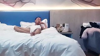 Cute amateur asian web cam girl playing with her toy