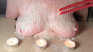 Breasts with hot candle wax and then beat
