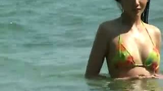 Busty asian on the beach (just-drew)
