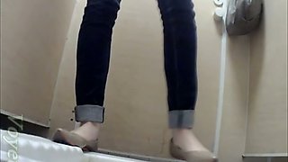 Pale skin slim white teen babe in jeans pisses in the toilet