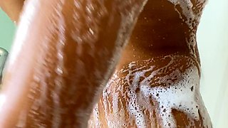 Busty curly brunette with big boobs fucks on couch