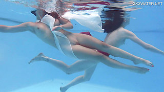 Girlfriends enjoy swimming naked together
