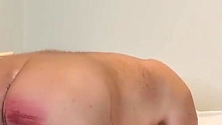 Young domme canes her slave