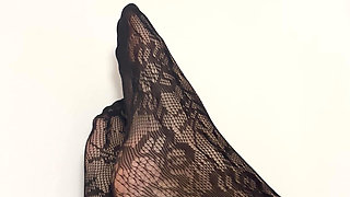 Rubbing my legs and feet in sexy black stocking