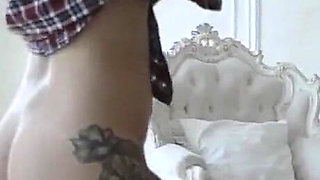Plumpy tattooed MILF is dancing striptease