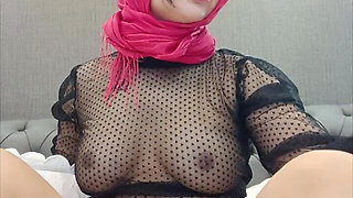 A Woman Wearing a Headscarf Passed by Herself in Her Bed