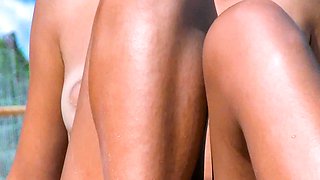 Playful young nudist chicks caught on a voyeur camera