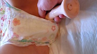 Babysitter Plays with Dildo in Wet Diaper