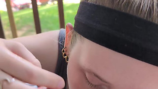 Blonde beauty giving a wet blowjob on the patio