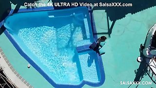 Tattooed Latina getting freaky by the pool