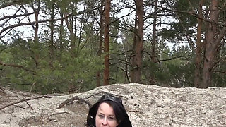 Hard self-fucking on a sandy dune