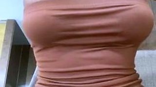 Busty babe playing with her big boobs