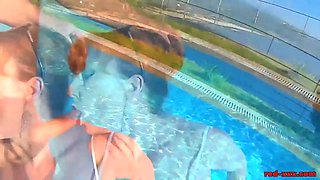 British Mature Red XXX sucking cock in a pool