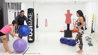 In a kitchen a sexy brunette playing with her big boobs