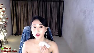 Big tits korean in swimsuit plays with dildo